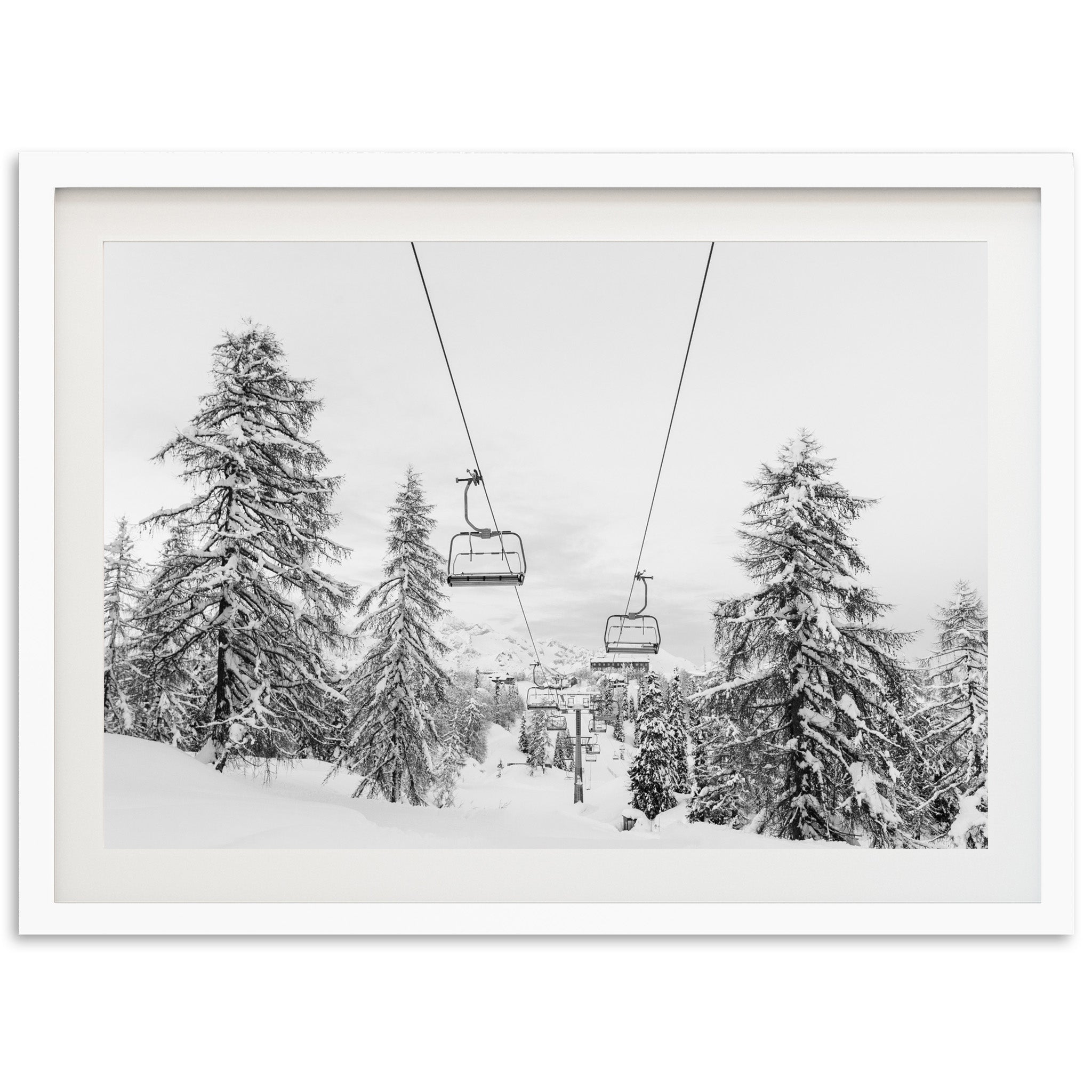 a black and white photo of a ski lift