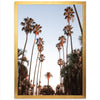 a picture of palm trees in a golden frame