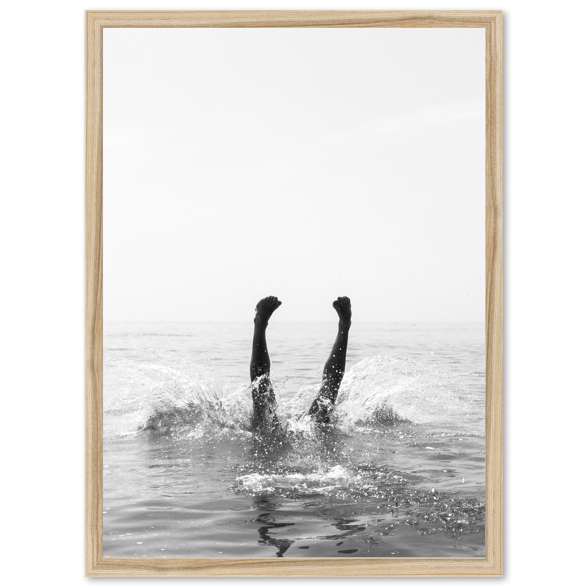 a black and white photo of a person in the water