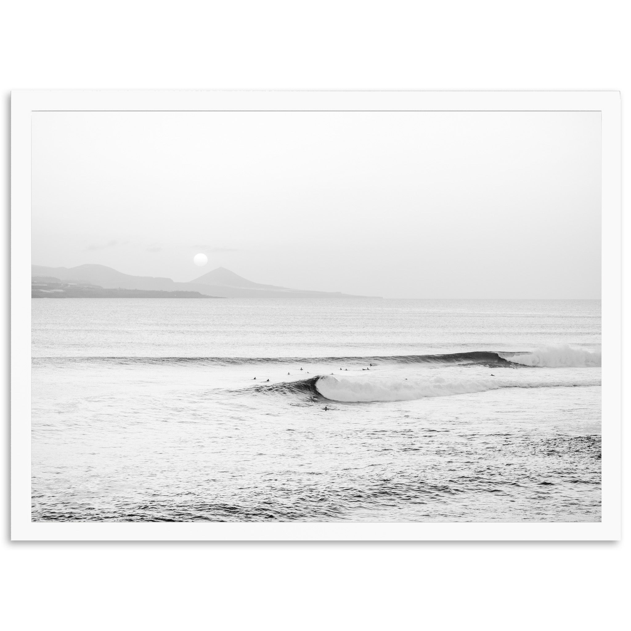 a black and white photo of a surfer riding a wave