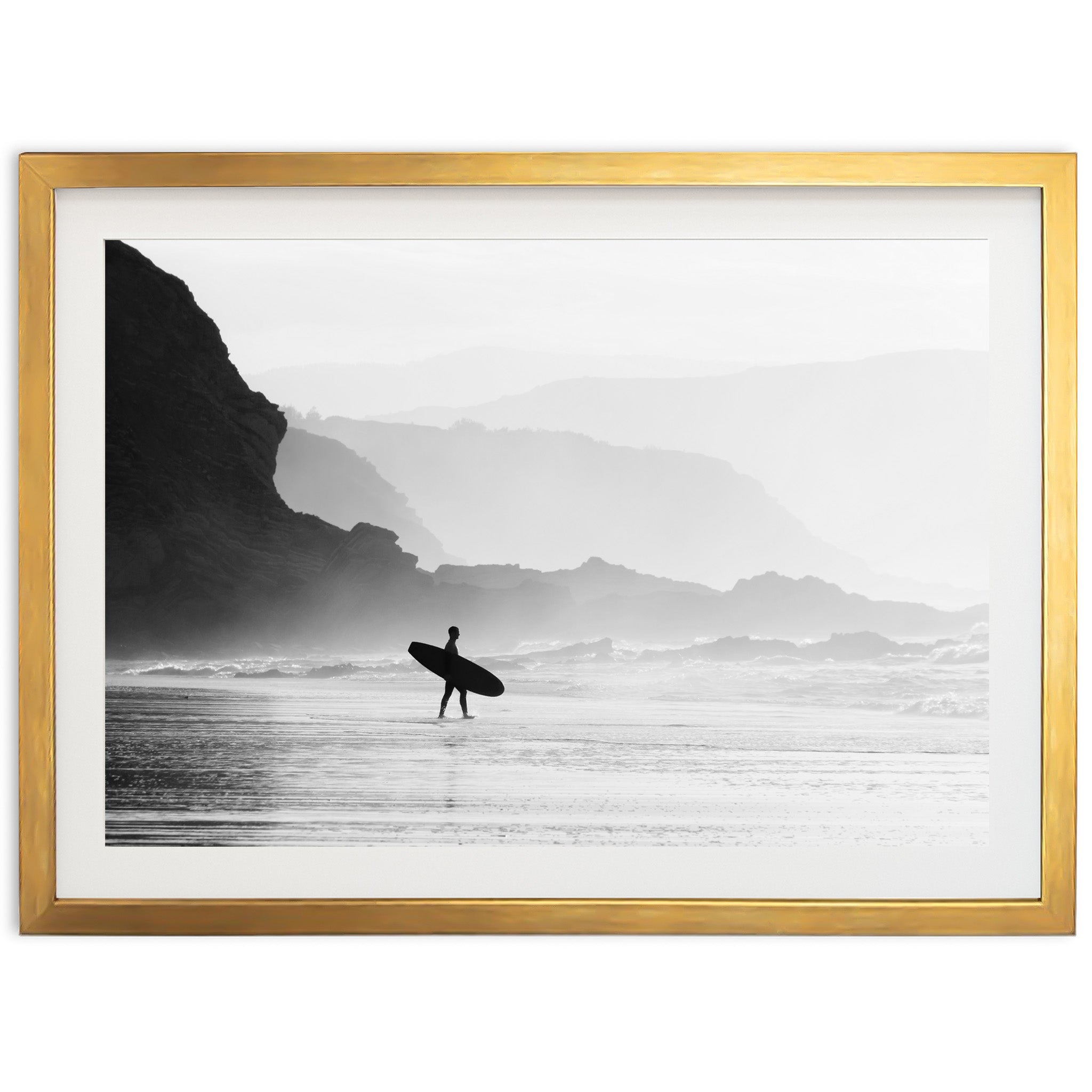 a black and white photo of a person holding a surfboard