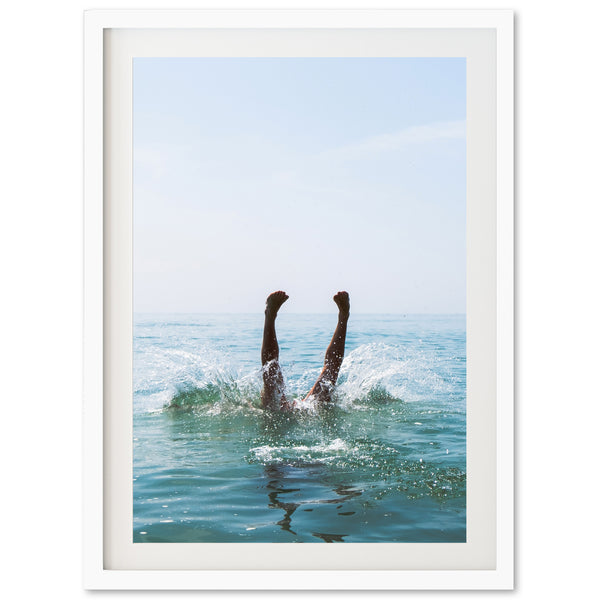 a picture of a person swimming in the ocean