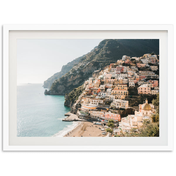 a picture of a village on a cliff overlooking the ocean