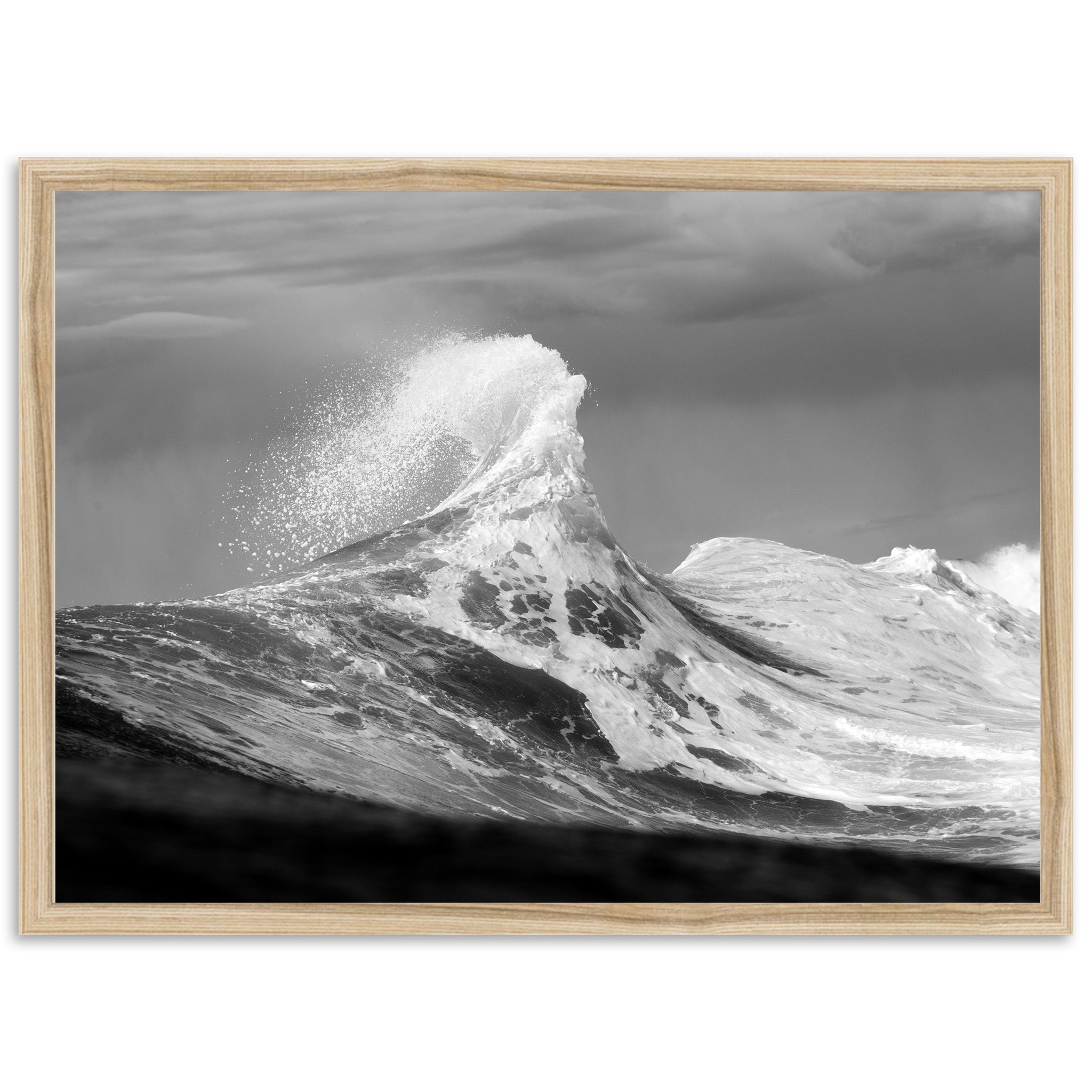 a black and white photo of a wave in the ocean