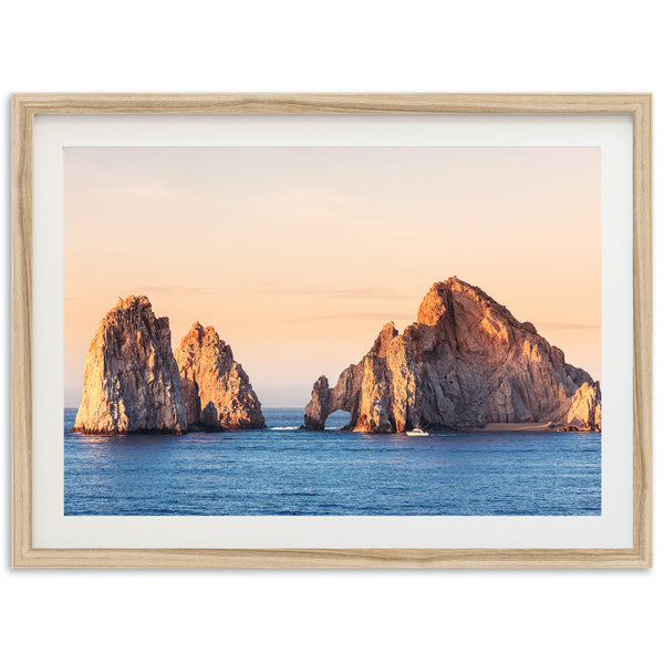 a picture of three large rocks in the ocean