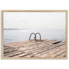 a wooden dock with a pair of shoes on it