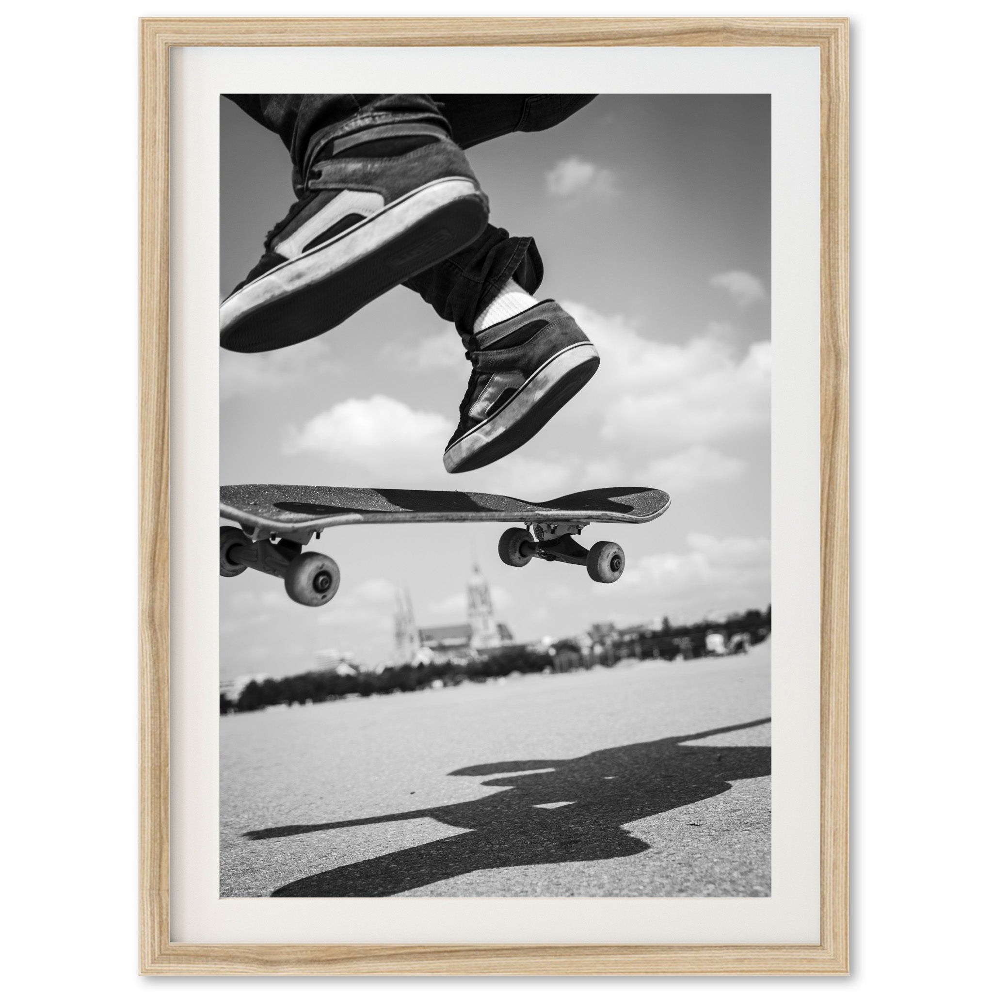 a black and white photo of a skateboarder doing a trick