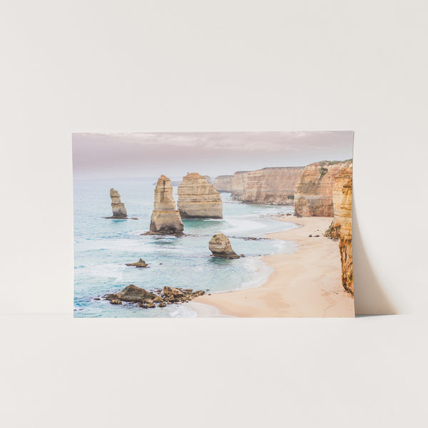 a picture of a beach with rocks in the water