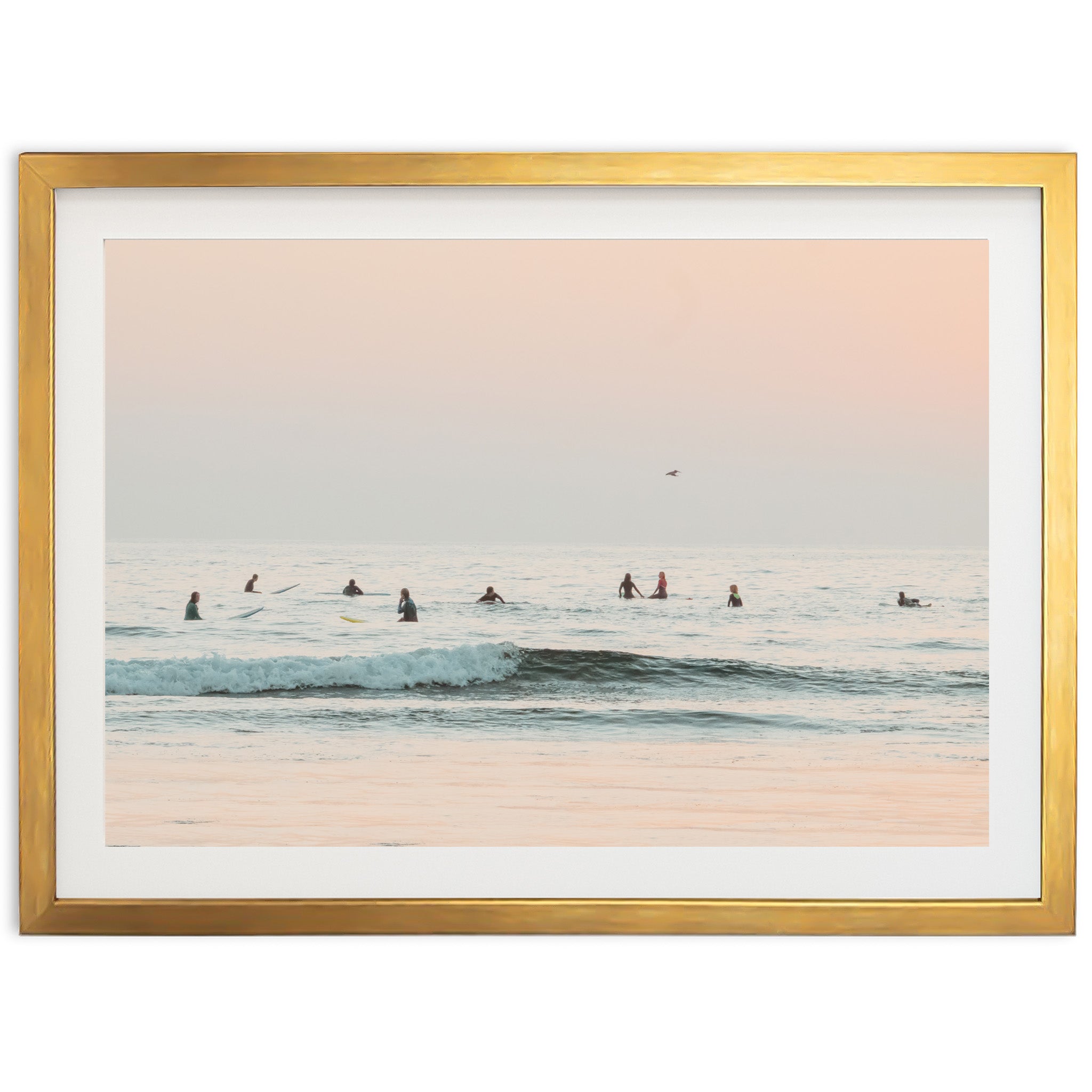 a group of people riding surfboards on top of a wave