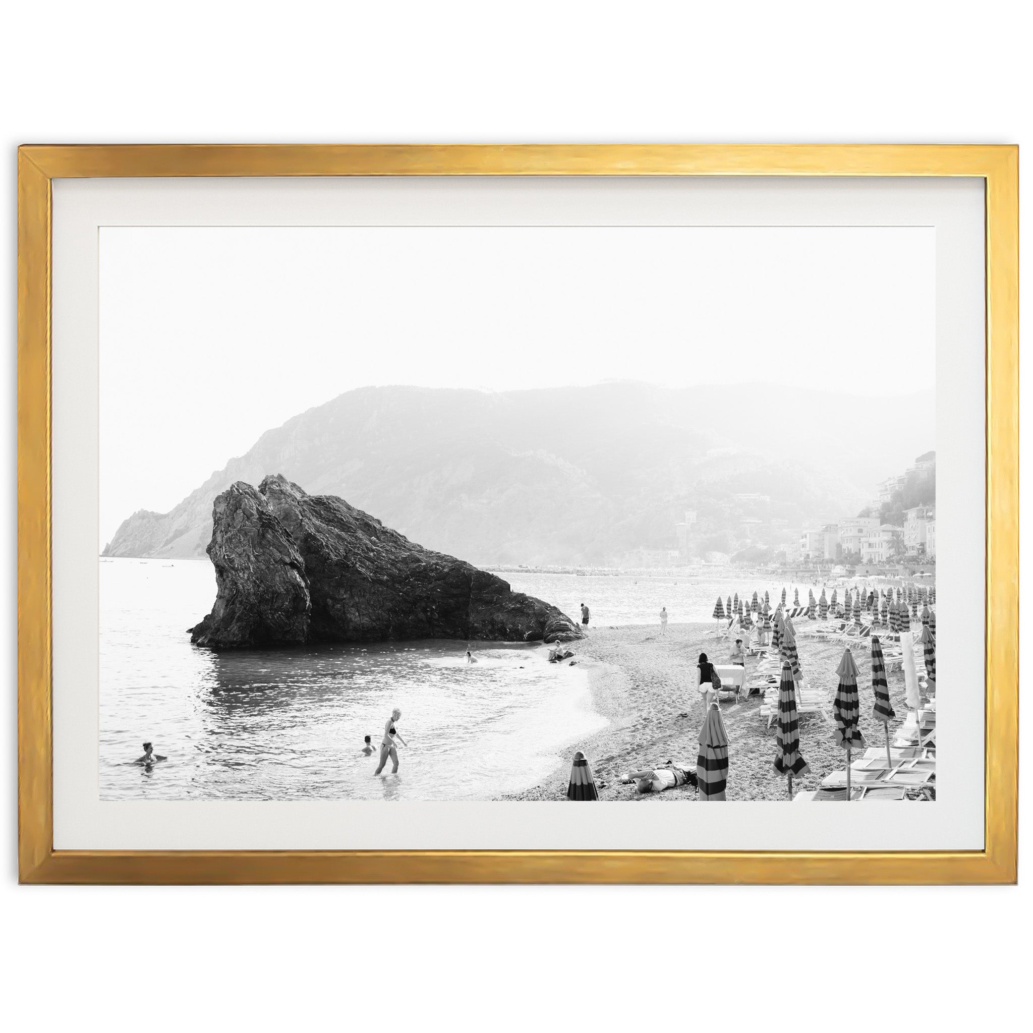 a black and white photo of a beach with umbrellas