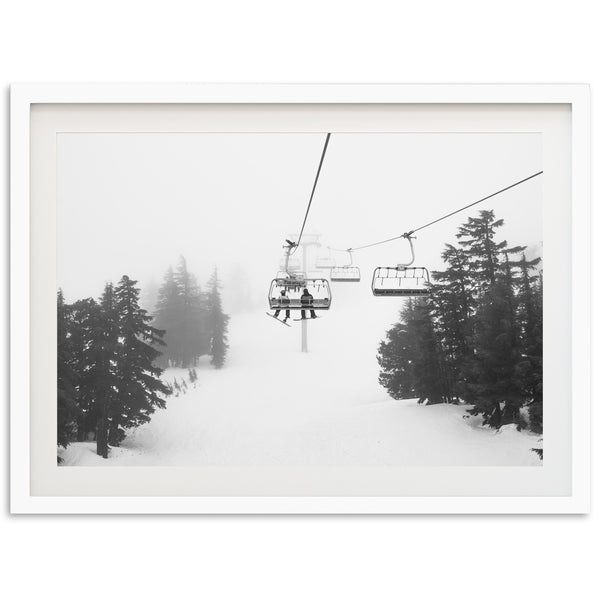 a black and white photo of a ski lift