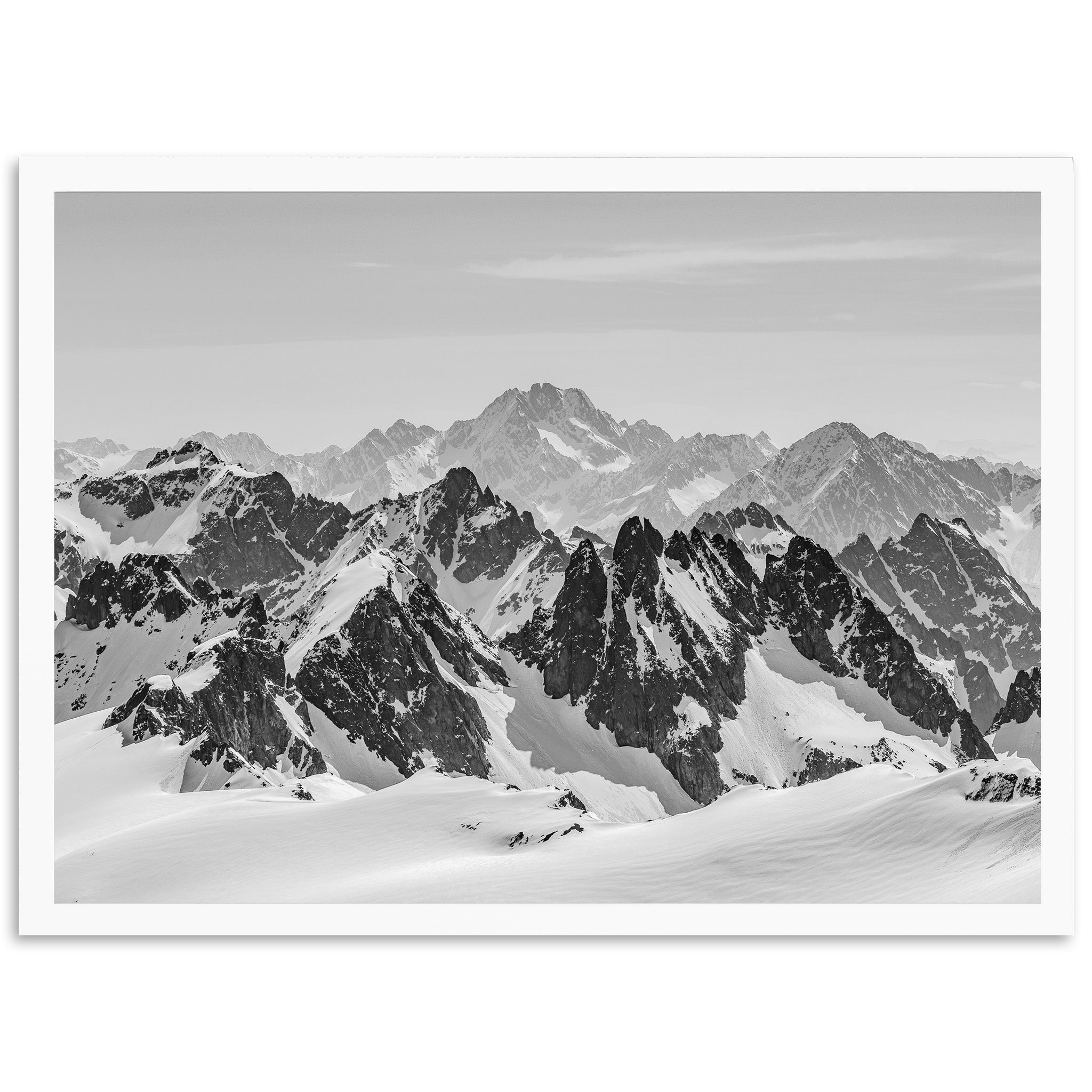 a black and white photo of a mountain range