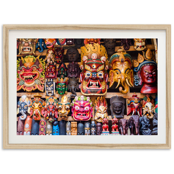 a group of colorful masks on display in a wooden frame