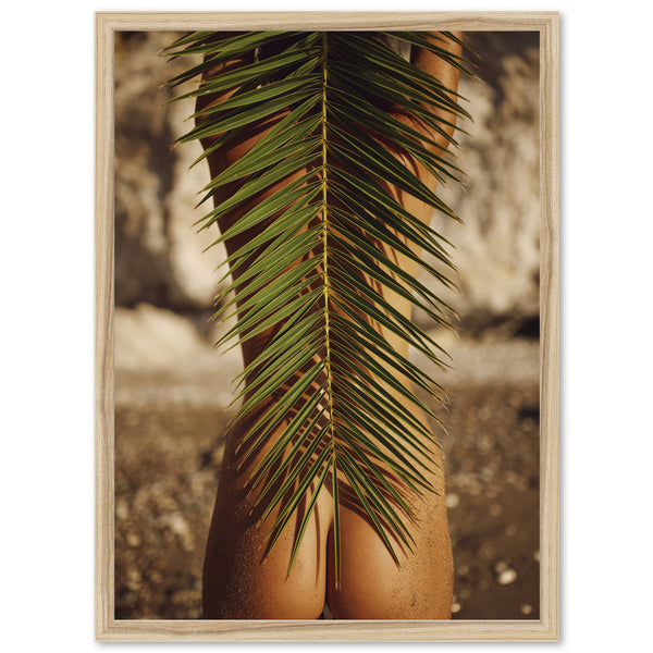 a picture of a woman's butt with a palm leaf