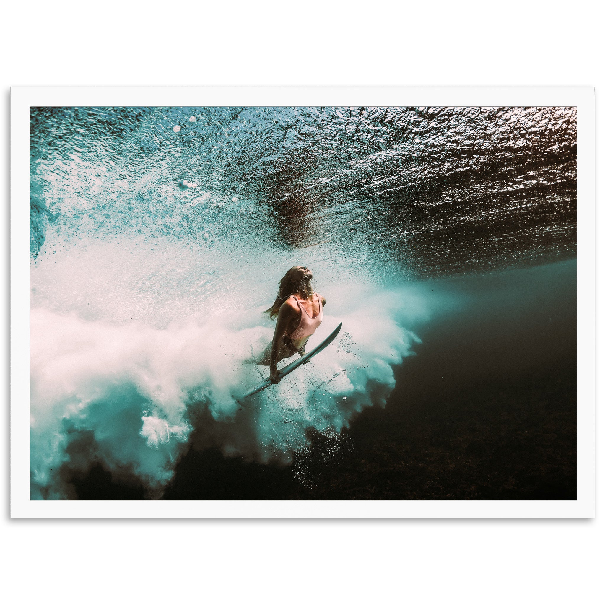 a person riding a surfboard on a wave in the ocean