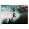 a person riding a surfboard on a wave in the ocean