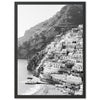 a black and white photo of a village on a cliff