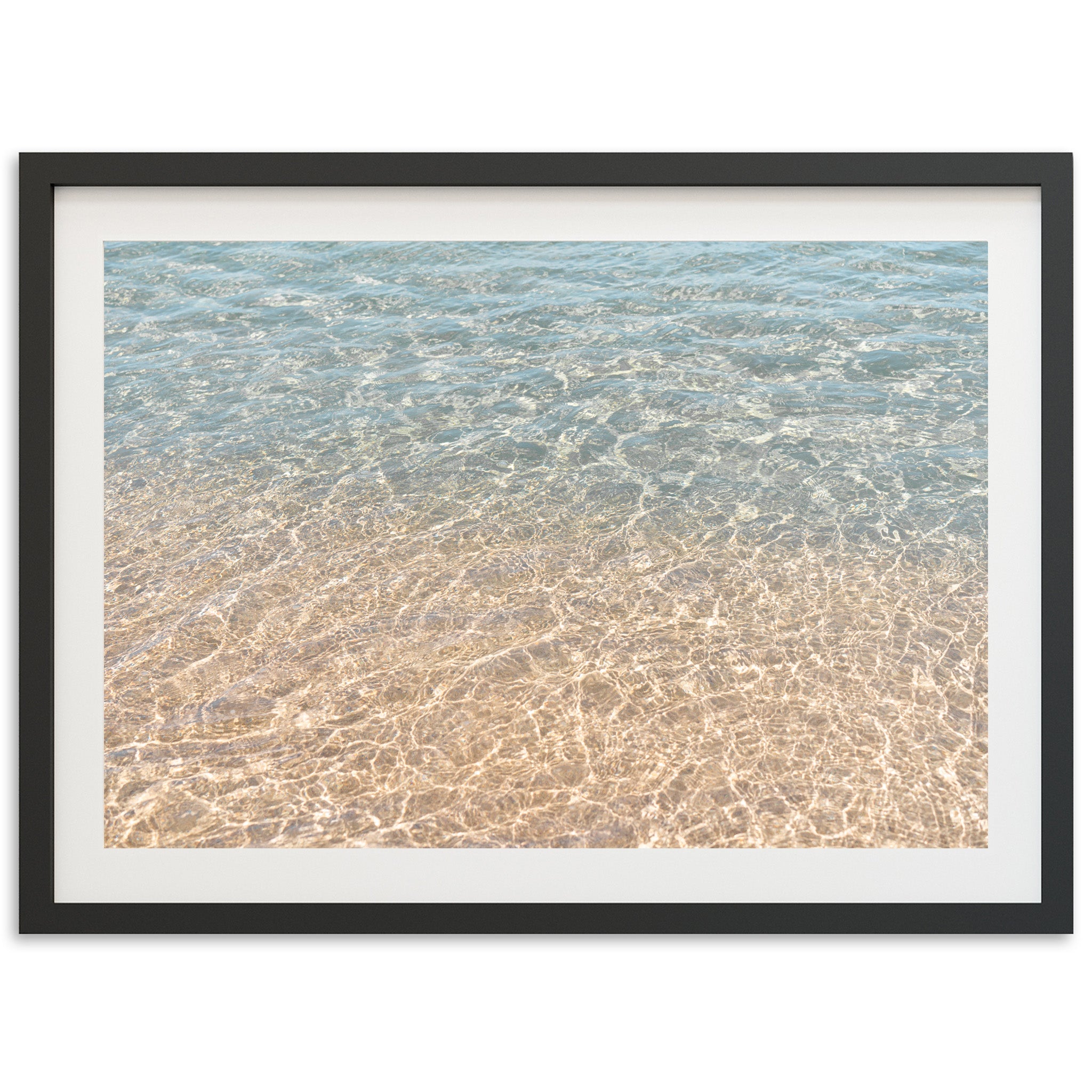 a picture of the water and sand of a beach