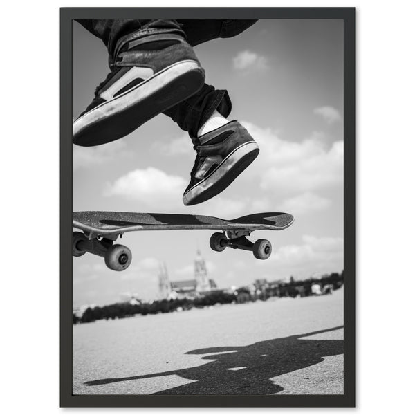 a black and white photo of a skateboarder doing a trick