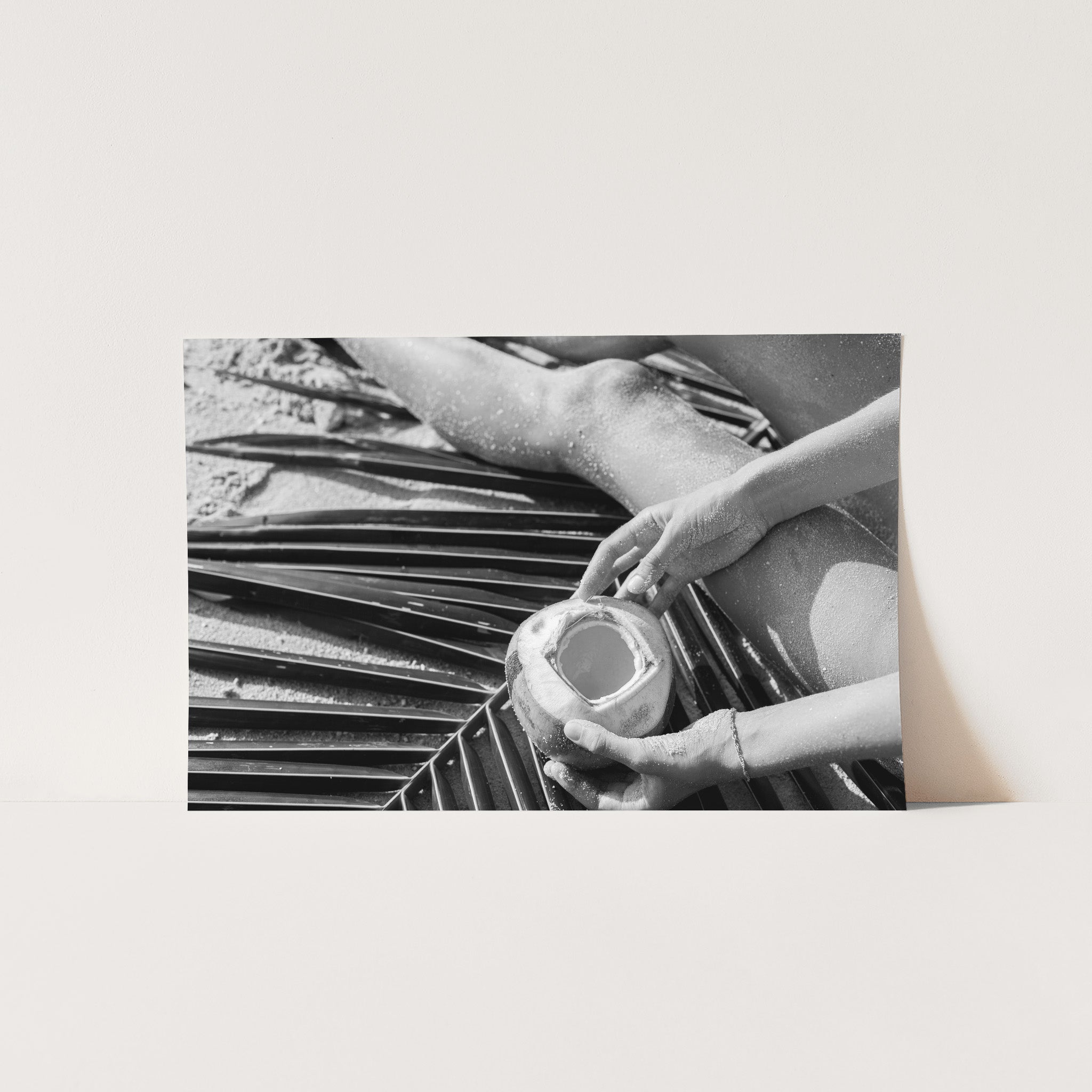 a black and white photo of a person holding a jar