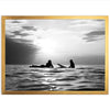 a black and white photo of two people on surfboards