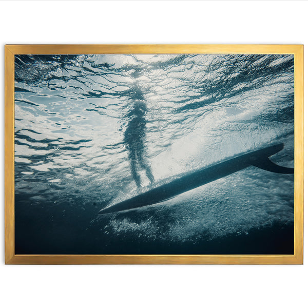 a person standing on a surfboard in the water