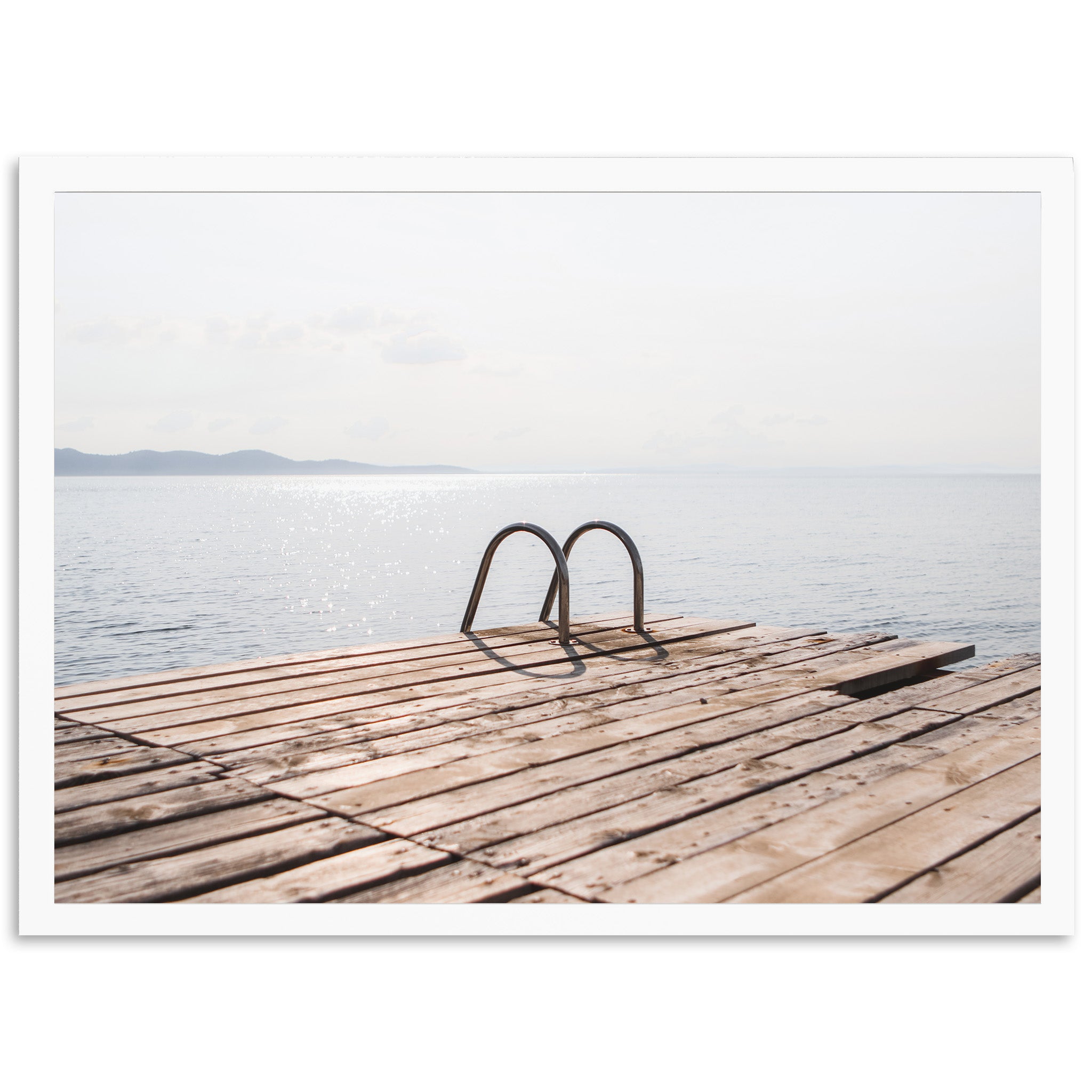 a wooden dock with a pair of shoes on it