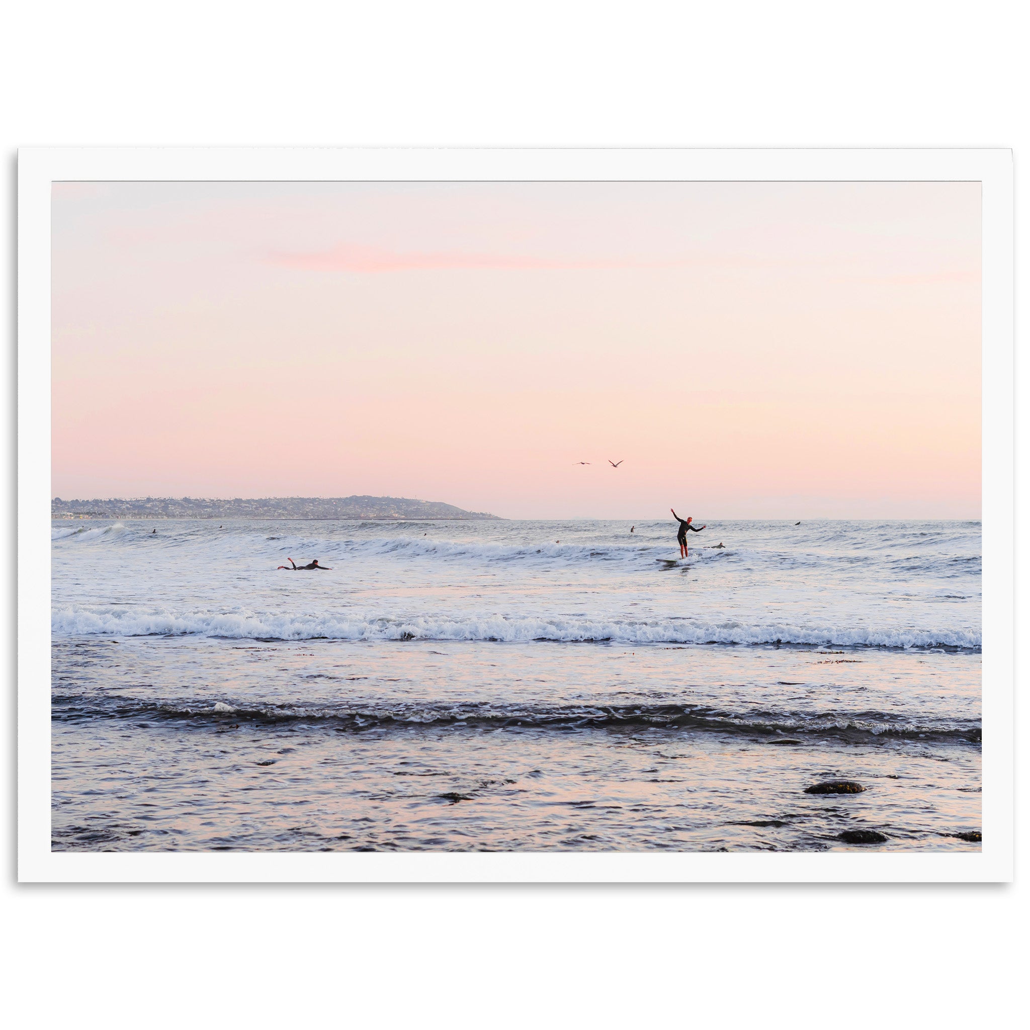 a person riding a surfboard on a wave in the ocean