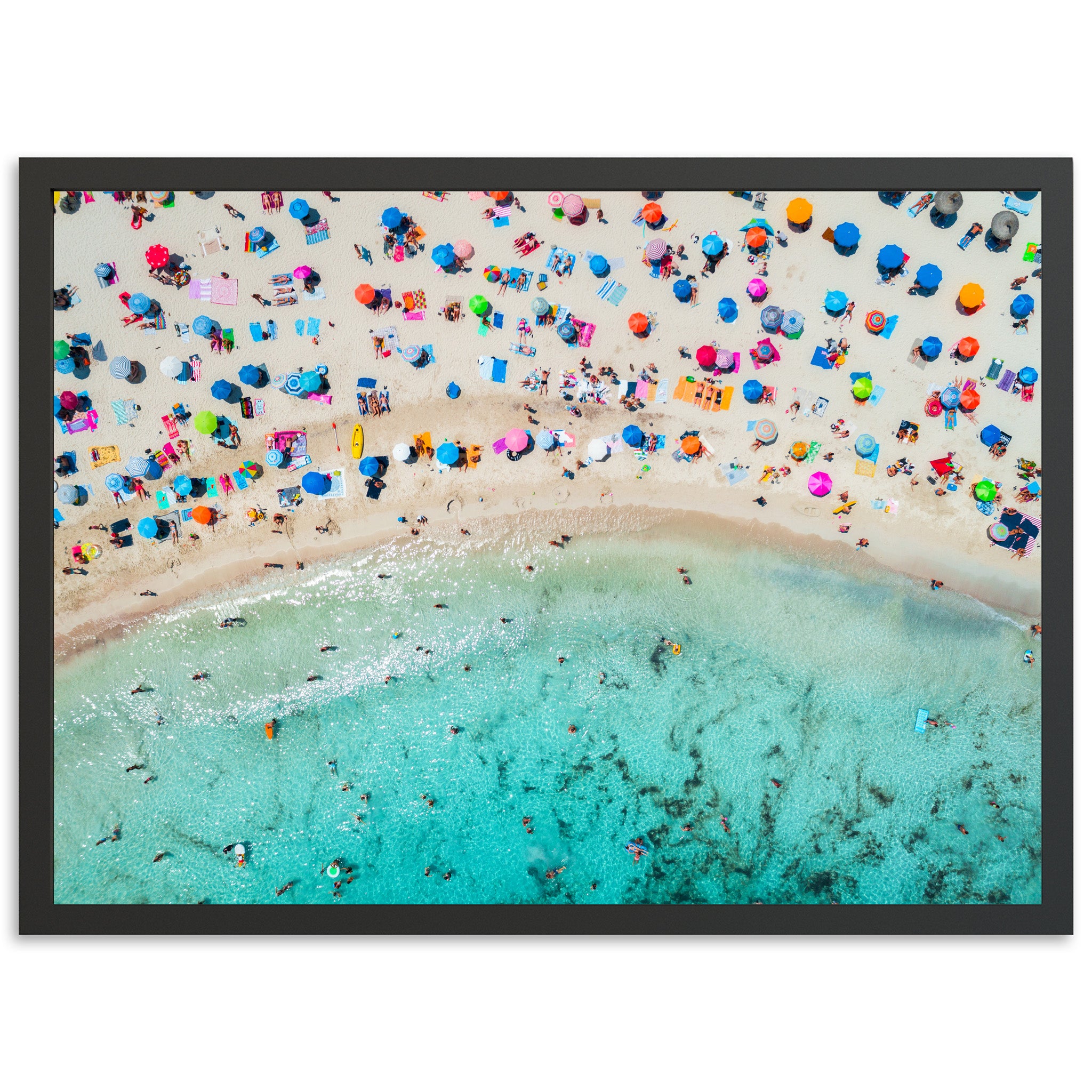 an aerial view of a beach with umbrellas