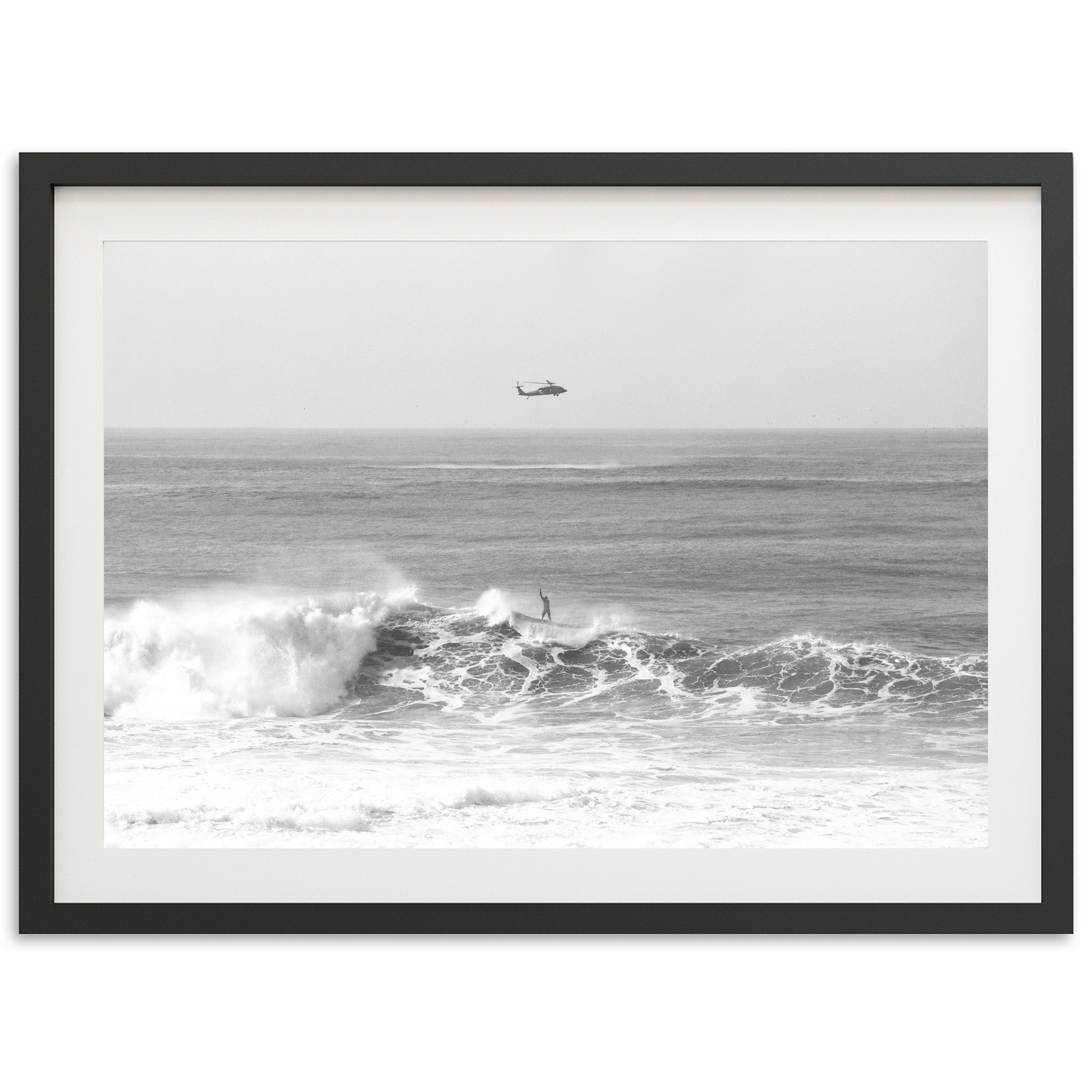 a black and white photo of a boat in the ocean