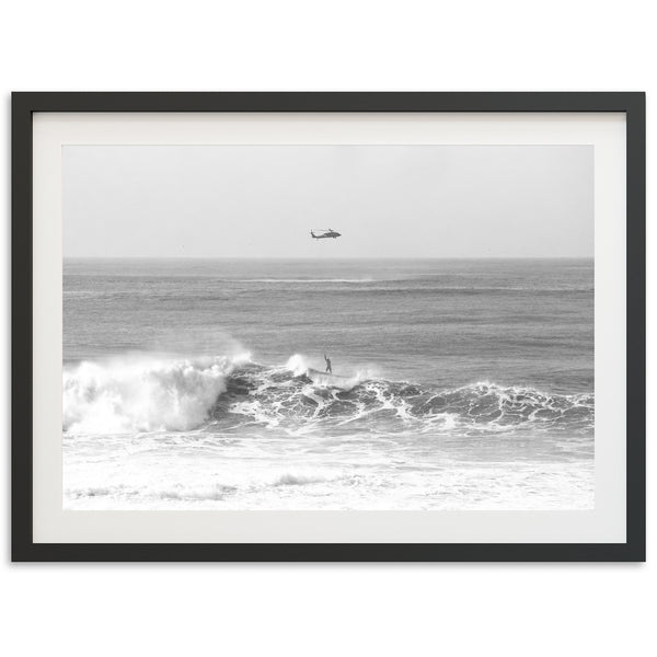 a black and white photo of a boat in the ocean