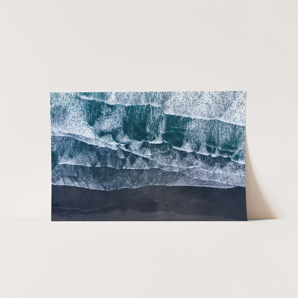 a painting of waves on a white wall