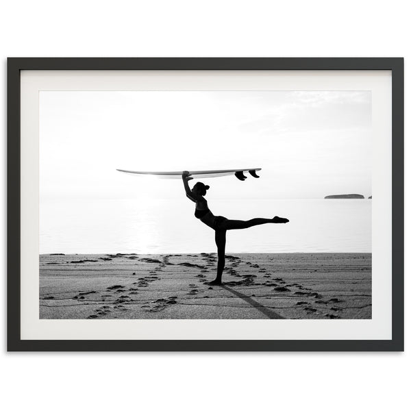 a man holding a surfboard over his head on a beach