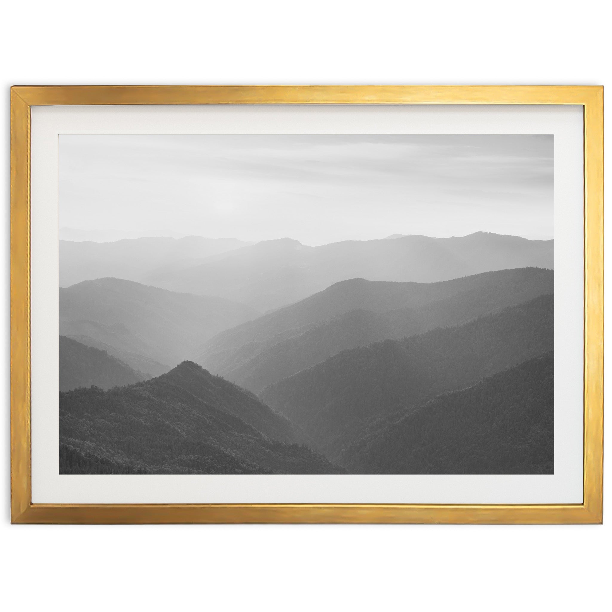 a black and white photo of a mountain range