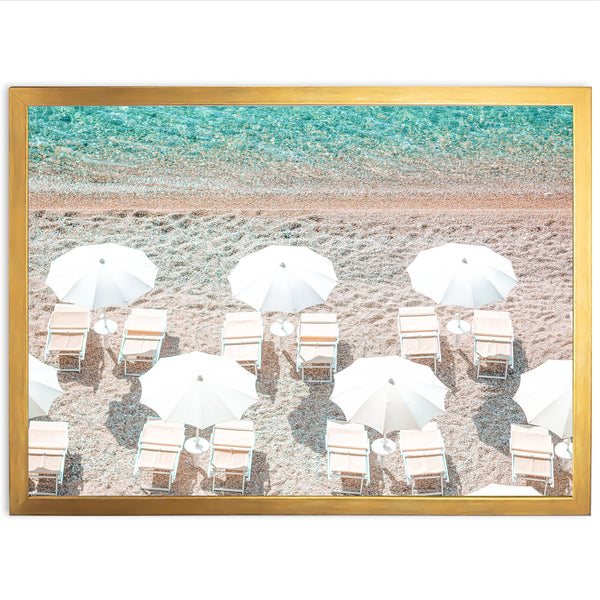 a group of chairs and umbrellas on a beach