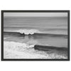 a black and white photo of a wave in the ocean