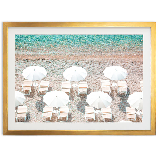 a picture of a beach with chairs and umbrellas