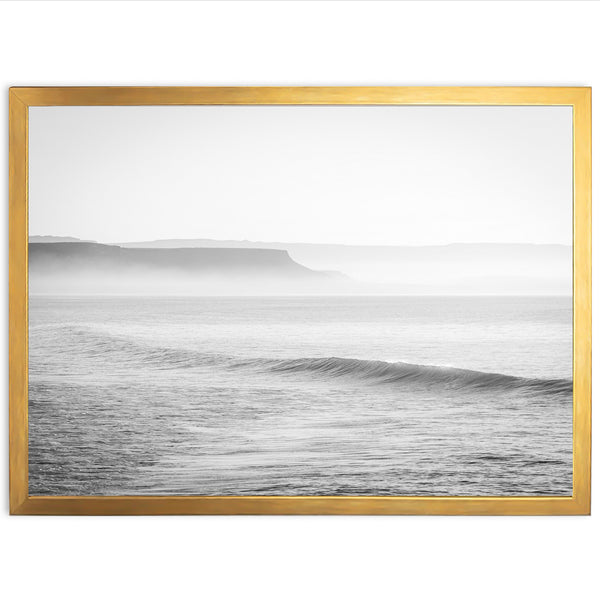 a black and white photo of a wave in the ocean