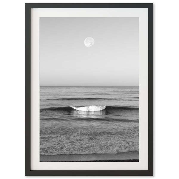 a black and white photo of a wave in the ocean