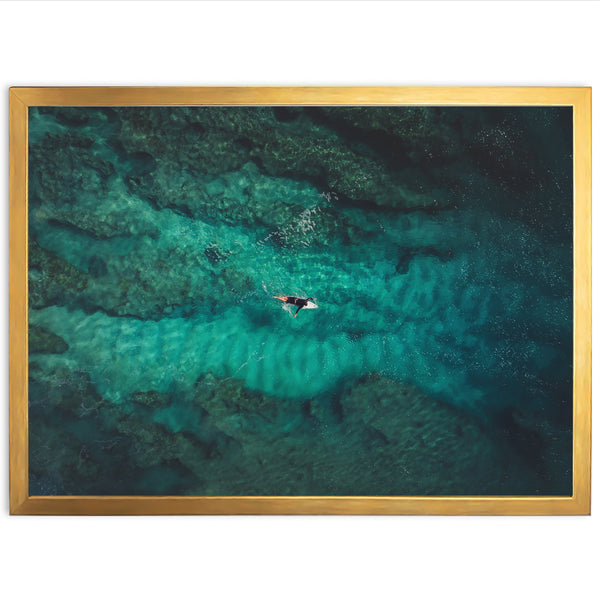 an aerial view of a boat in the ocean