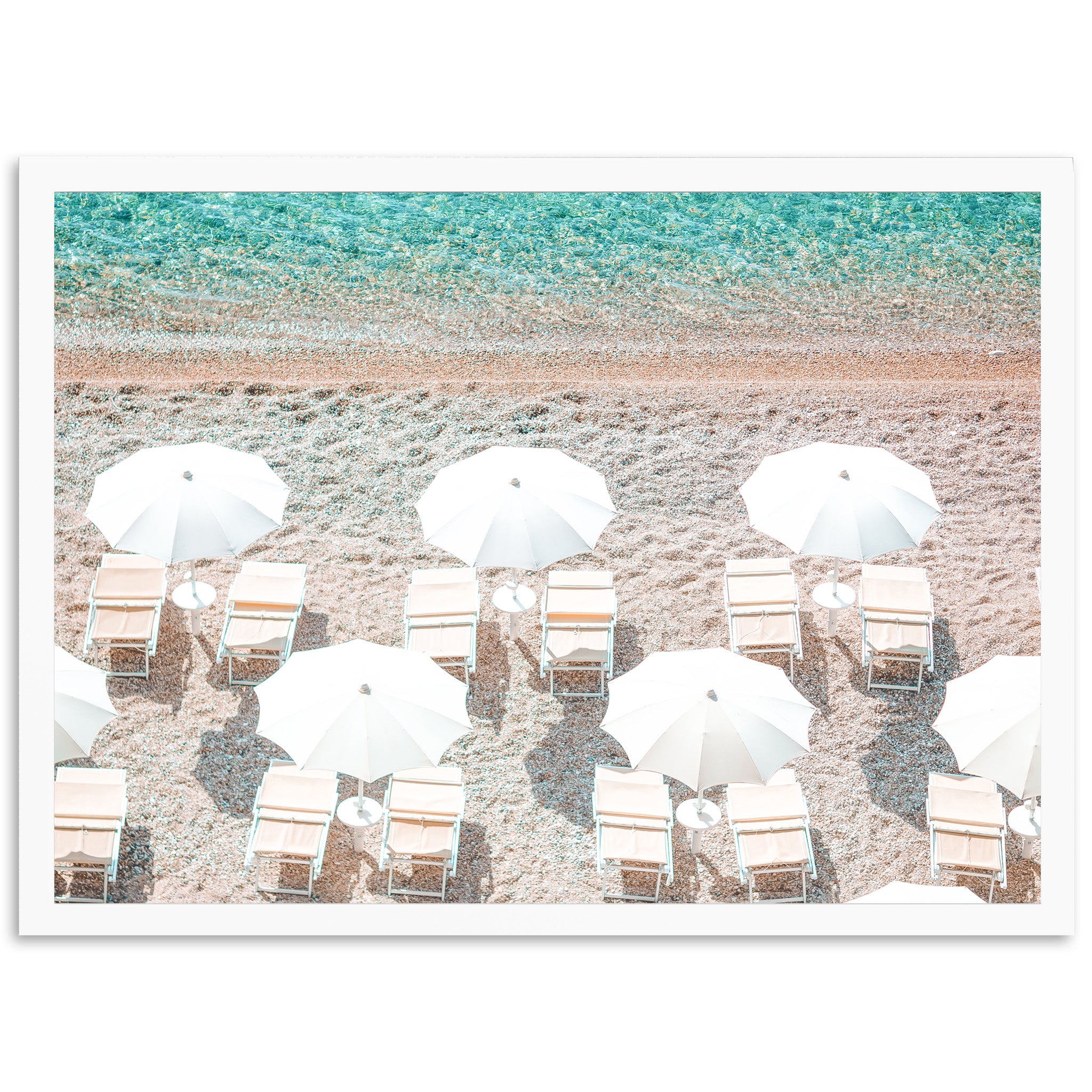 a group of beach chairs and umbrellas on a beach