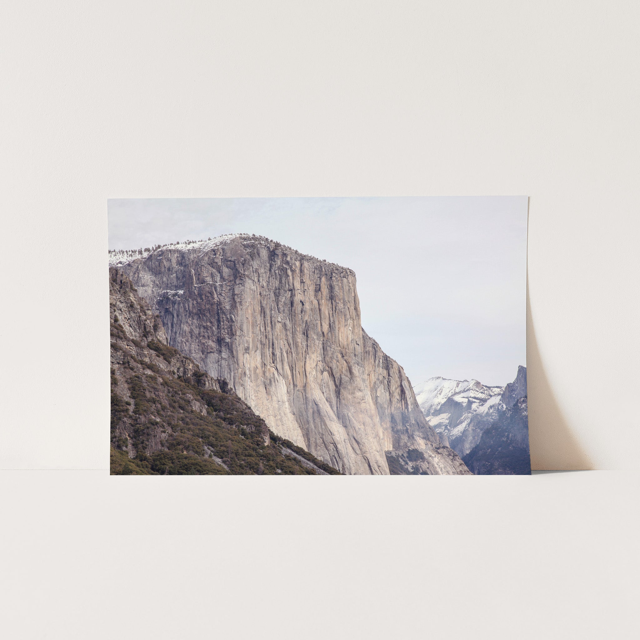 a polaroid photo of a mountain with snow on it