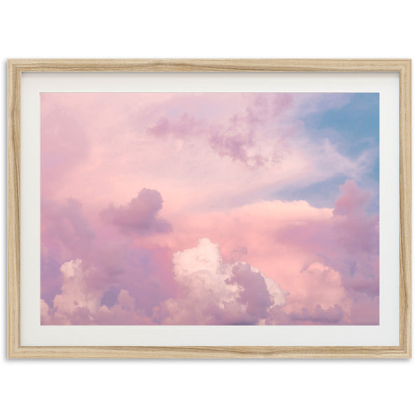 a pink and blue sky with white clouds