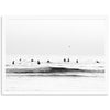 a black and white photo of surfers in the ocean