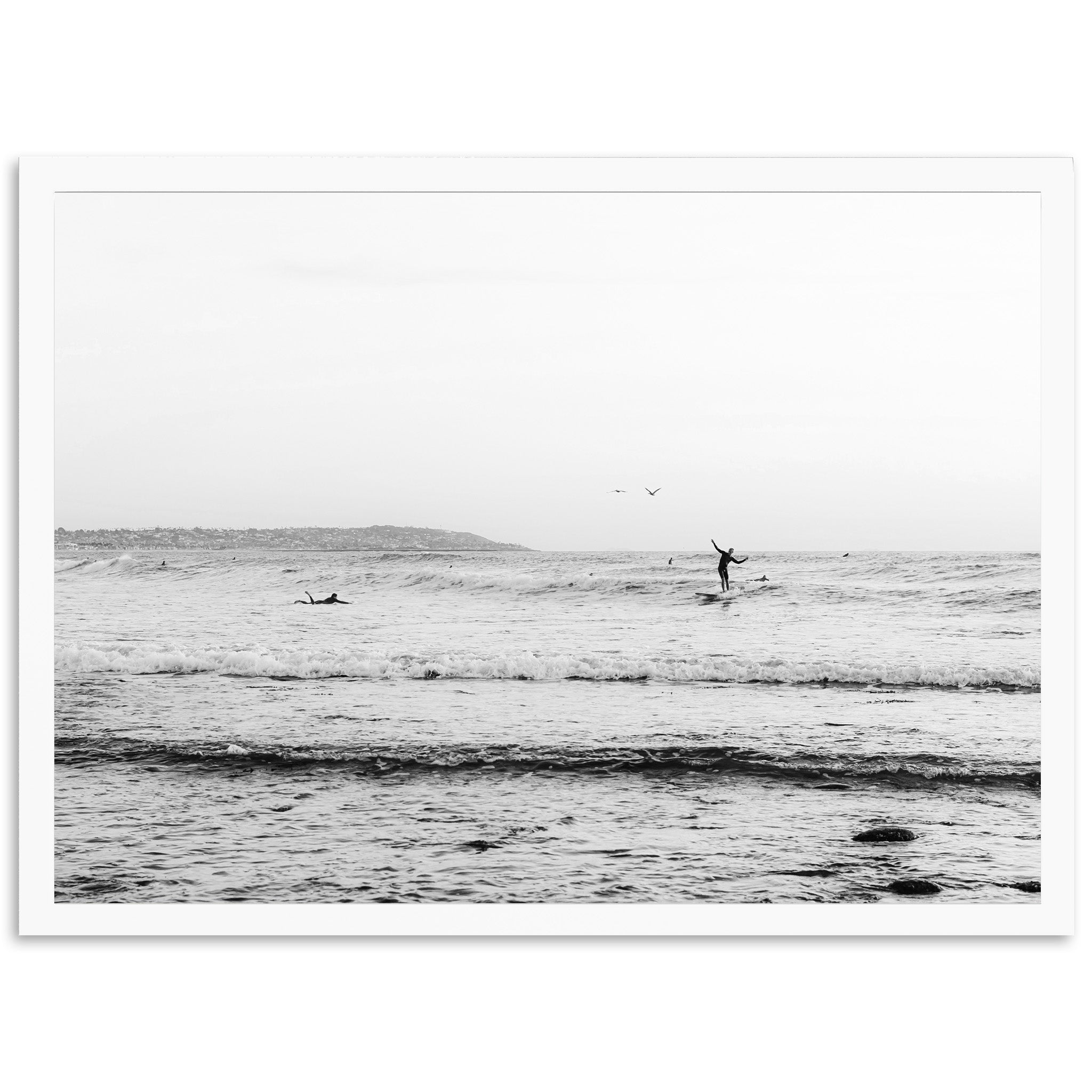 a person riding a surfboard on a wave in the ocean