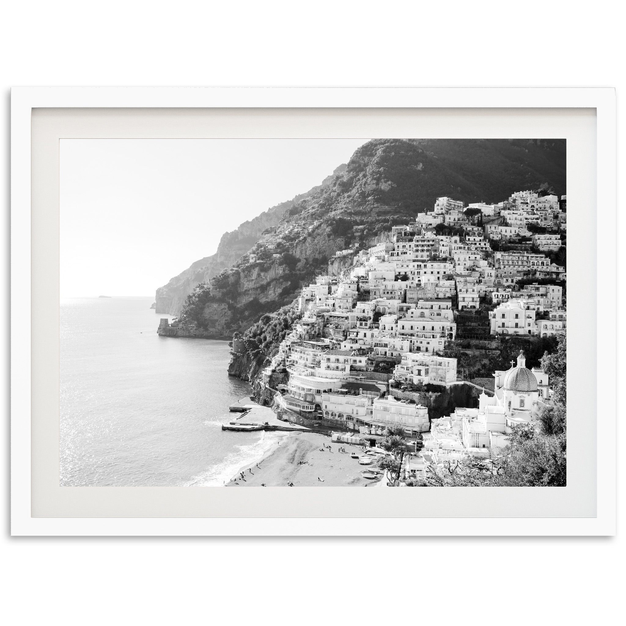 a black and white photo of a village by the ocean