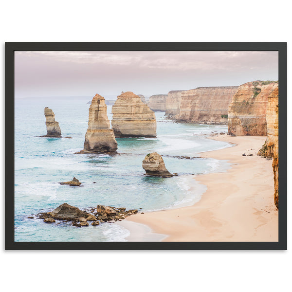 a picture of a beach with some rocks in the water