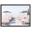 a picture of some chairs and umbrellas on the beach