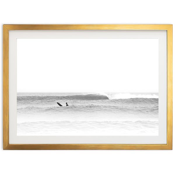 a black and white photo of a surfer riding a wave