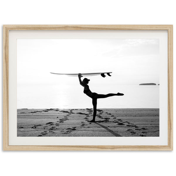 a man holding a surfboard over his head on a beach